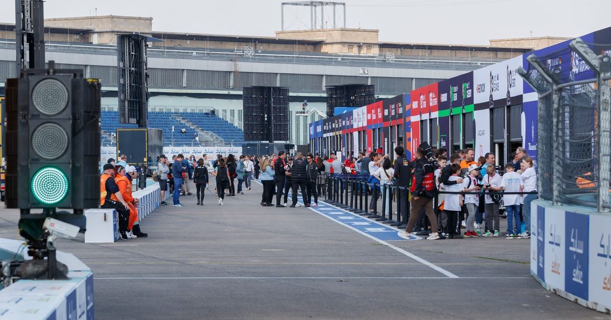 a Formula E car on a street circuit, chosen to visually contrast with typical Formula 1 imagery