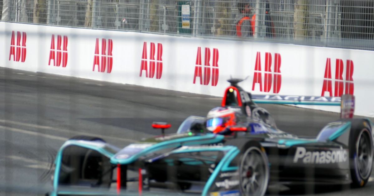 a Formula E grid or pit lane before a race, conveying the city-circuit setting for a newcomer