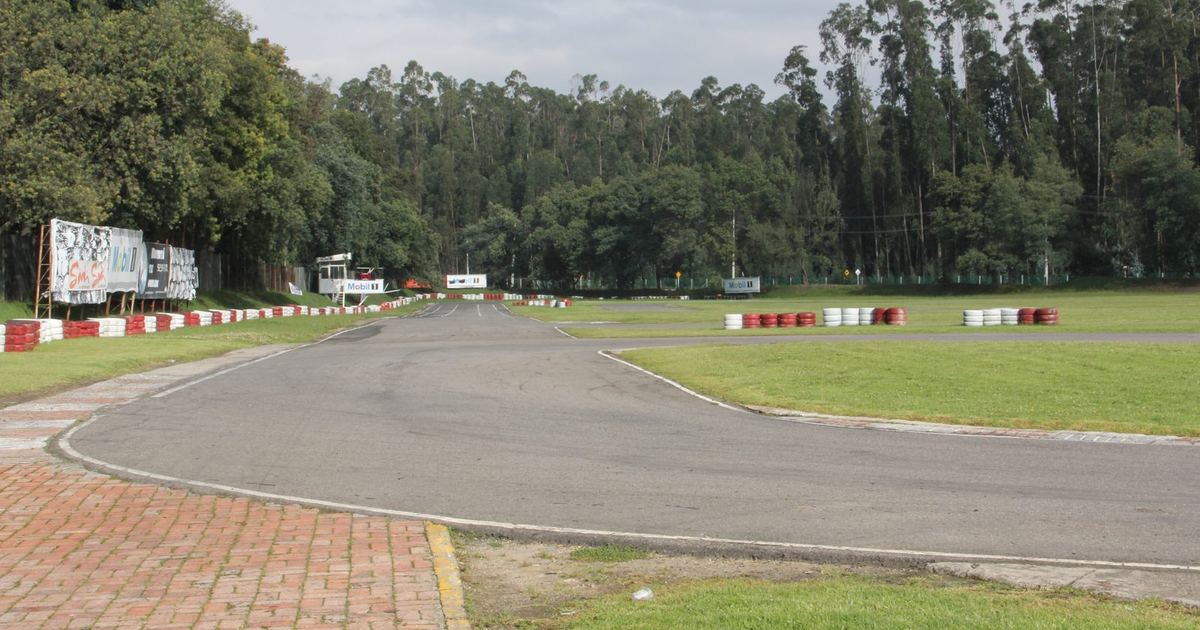 a field of competition karts racing at a national or international level event