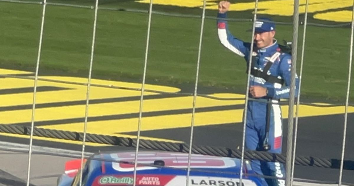 Kyle Larson celebrates a 2026 win, standing on his Hendrick Motorsports Chevrolet