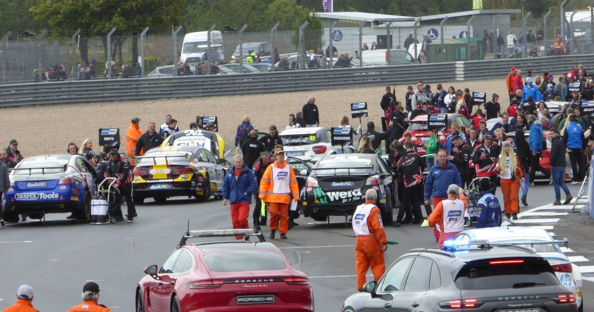 a full BTCC grid before the start of a race, conveying the three-race weekend format