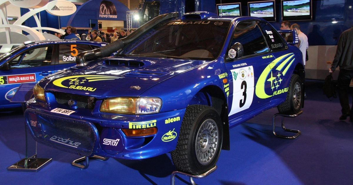 A rally car competing on the gravel terrain of the Safari Rally in Kenya