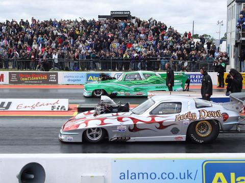 a dragster launching in a straight line, contrasted conceptually against a drifting car's sideways slide