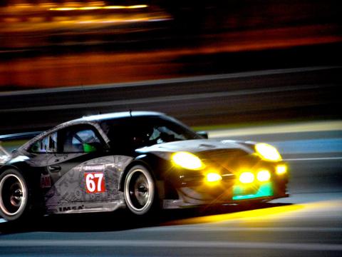 an endurance racing car at night with headlights illuminated, contrasted conceptually against a daytime F1 image