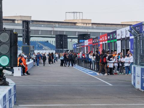 a Formula E car on a street circuit, chosen to visually contrast with typical Formula 1 imagery
