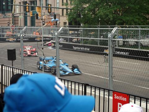 IndyCar practice or qualifying at Indianapolis Motor Speedway, conveying the scale and tradition of the 500