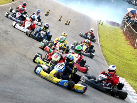 a young competitive kart racer, illustrating karting's role as a training ground for future professional drivers