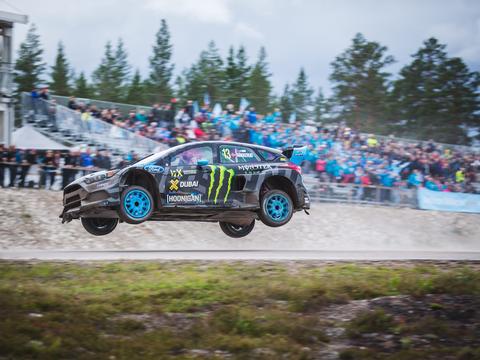 a rallycross car taking the Joker Lap section, visibly diverging from the main circuit