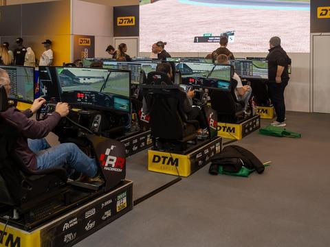a sim racing cockpit mid-session, conveying the competitive, ranked nature of online sim racing