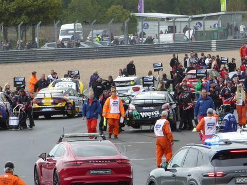 a full BTCC grid before the start of a race, conveying the three-race weekend format