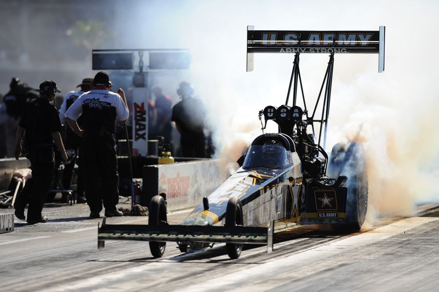 a dragster performing a burnout before staging for a run
