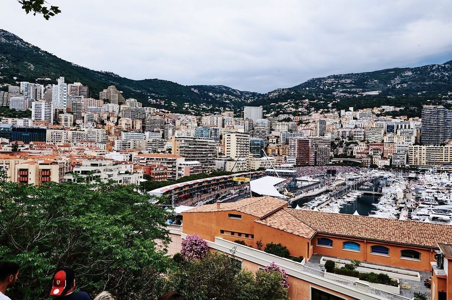 F1 cars racing through the streets of Monaco in 2023, illustrating the mix of street circuits and permanent tracks a new fan will encounter across a season