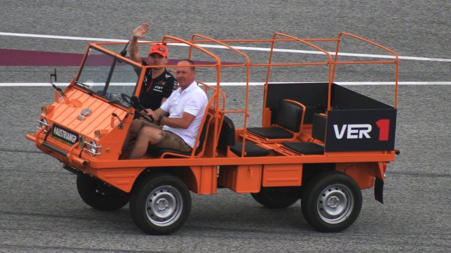 An F1 car at full cornering load, illustrating the lateral g-forces a driver's body must resist through a fast corner