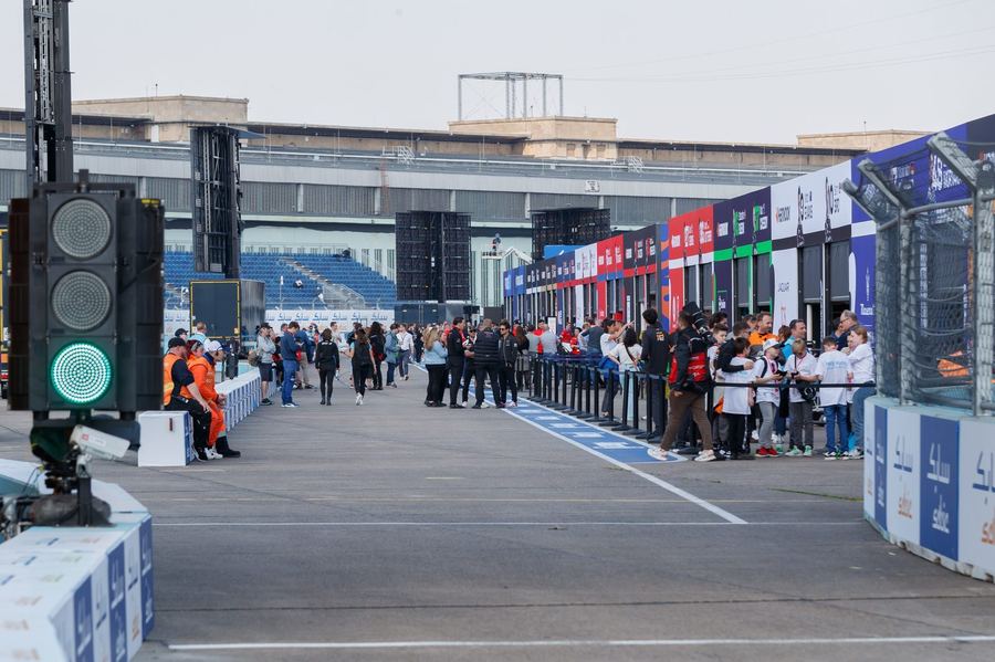 a Formula E car on a street circuit, chosen to visually contrast with typical Formula 1 imagery