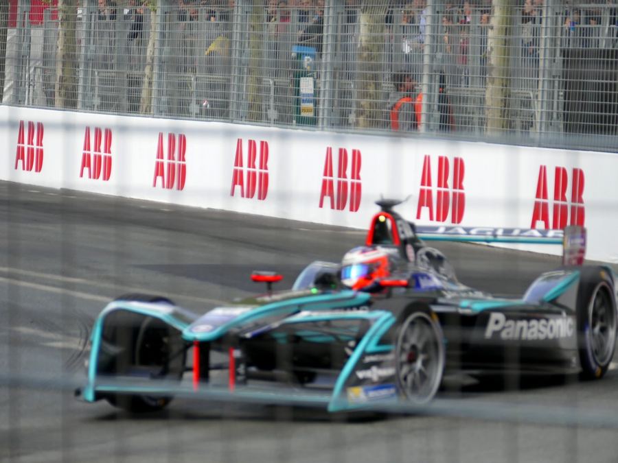 a Formula E grid or pit lane before a race, conveying the city-circuit setting for a newcomer