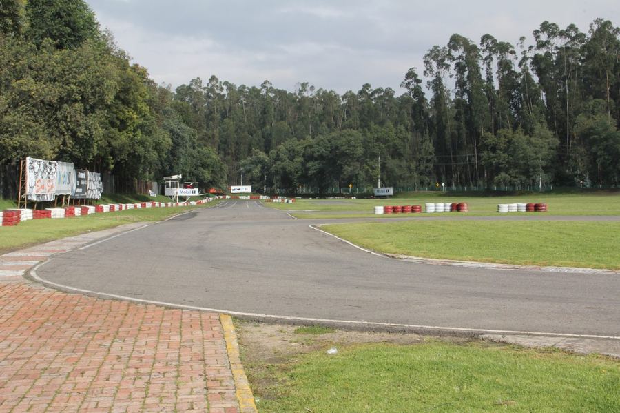 a field of competition karts racing at a national or international level event