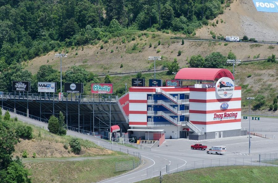 NASCAR cars racing at Bristol Motor Speedway, illustrating the terminology this glossary defines