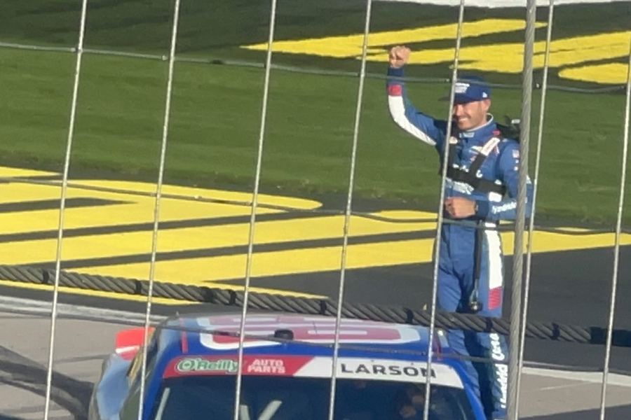 Kyle Larson celebrates a 2026 win, standing on his Hendrick Motorsports Chevrolet