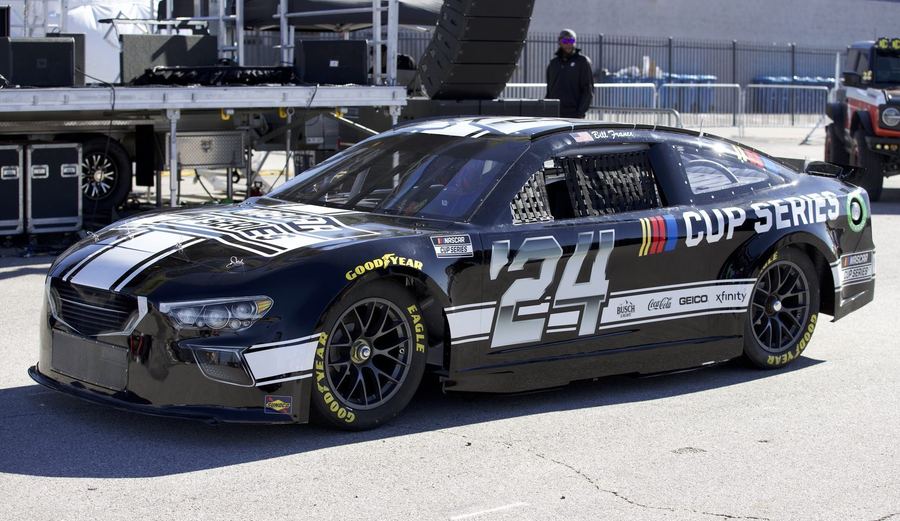 A NASCAR Next Gen car racing at Las Vegas Motor Speedway in 2024, showing the spec chassis shared across all three manufacturers