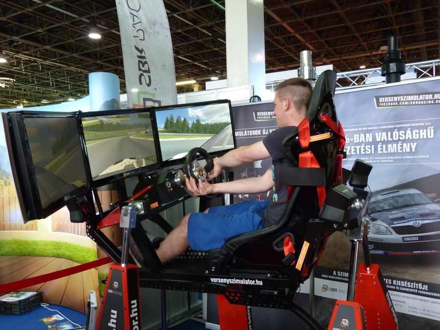 a close-up of sim racing wheel and pedal hardware, illustrating entry-level equipment