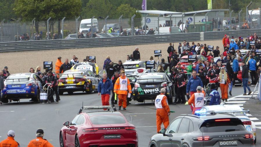a full BTCC grid before the start of a race, conveying the three-race weekend format